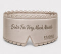 Fragile satin sleep mask in Oyster, padded with scalloped stitched edge and tonal embroidered script