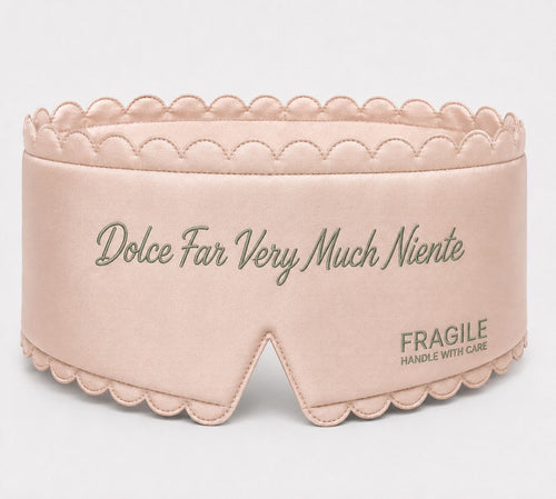 Fragile satin sleep mask in Shell pink with sage green embroidered script and scalloped edge